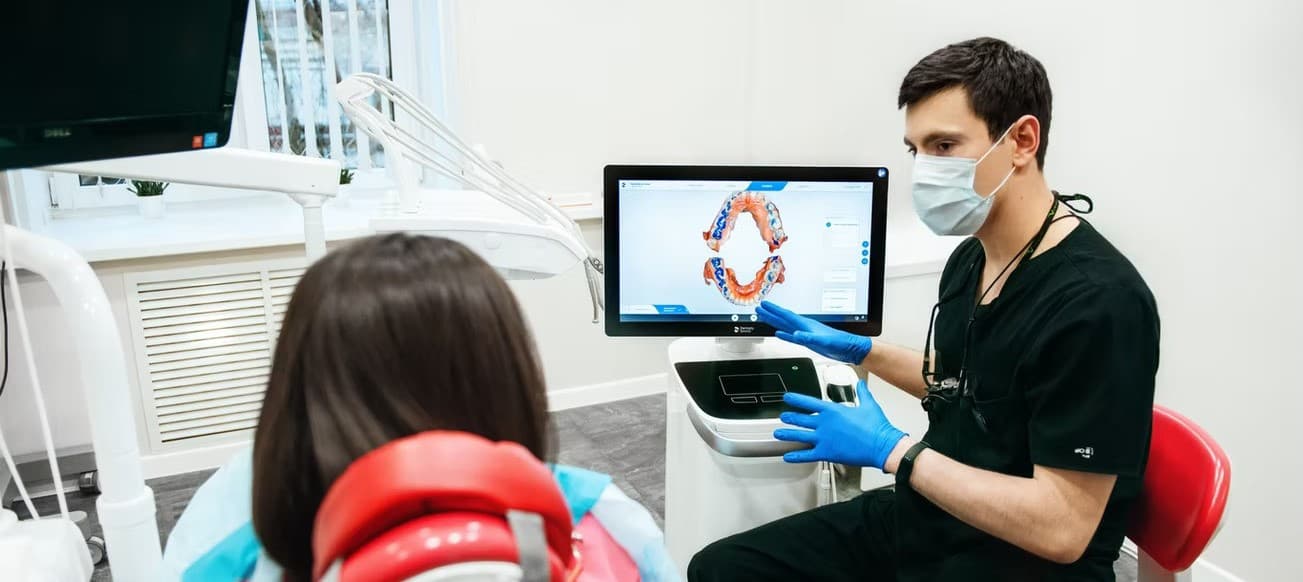 Dentist consults with a patient